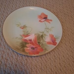 Nippon hand painted plate that features flowers, preowned